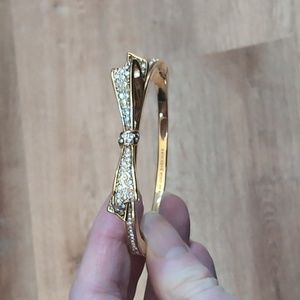 Kate Spade New York bow gold colored hinged bracelet